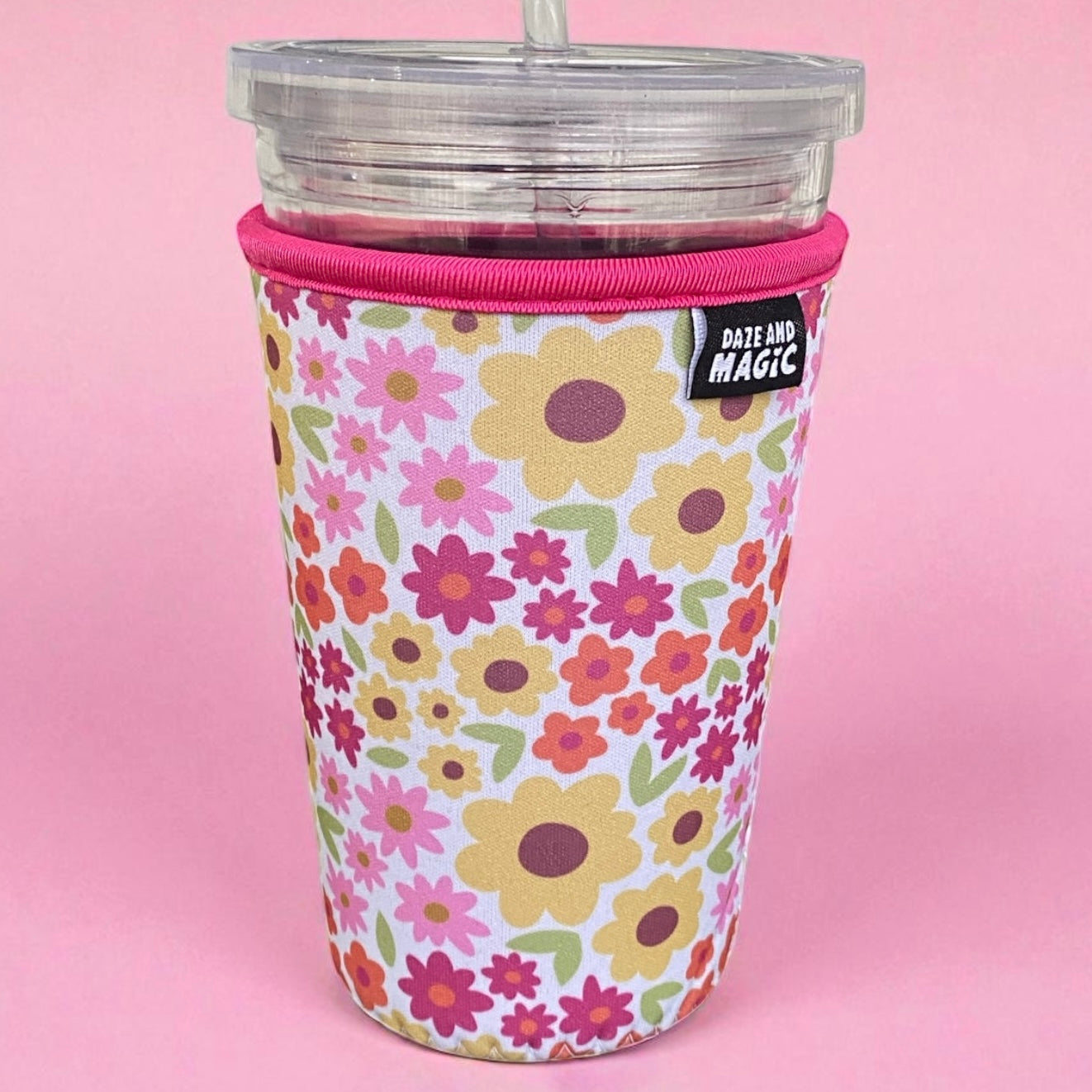 Fall floral patterned iced coffee sleeve 24oz on a pink background