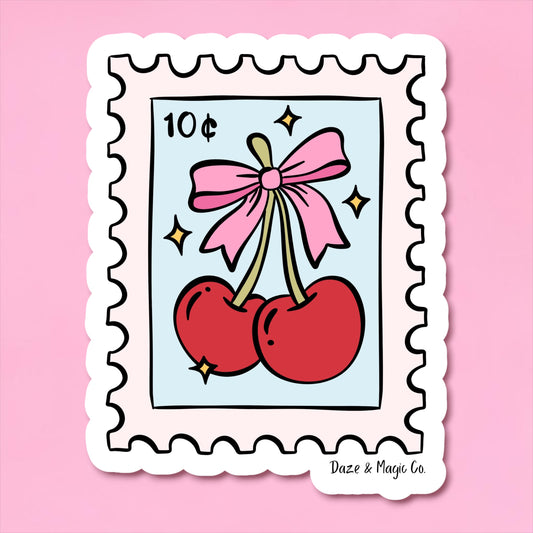 Illustration of cherries with a pink bow on a postage stamp design against a pink background.