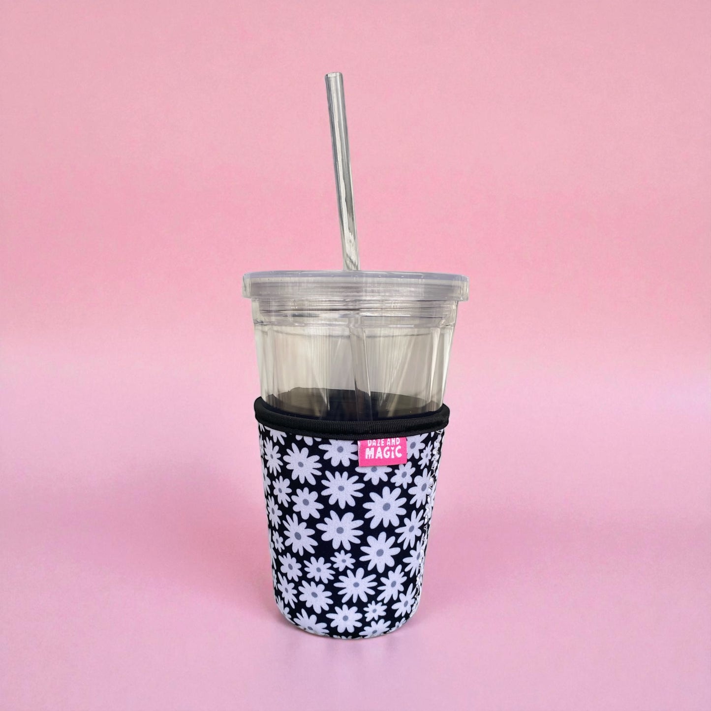 Daisy Daze 16oz neoprene iced coffee sleeve on clear plastic iced coffee cup