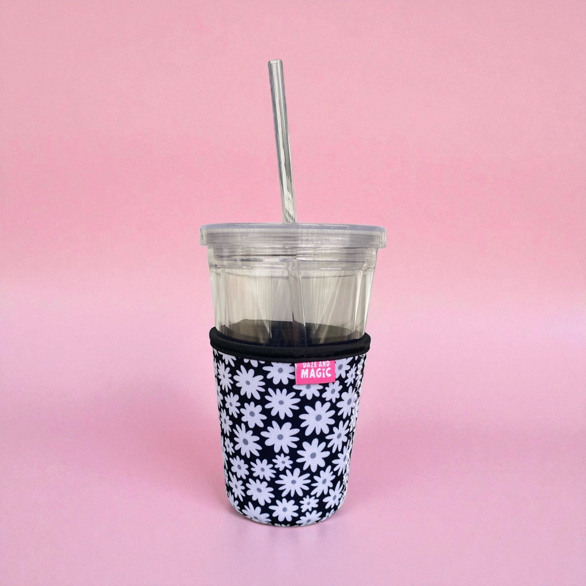 Daisy Daze 16oz neoprene iced coffee sleeve on clear plastic iced coffee cup