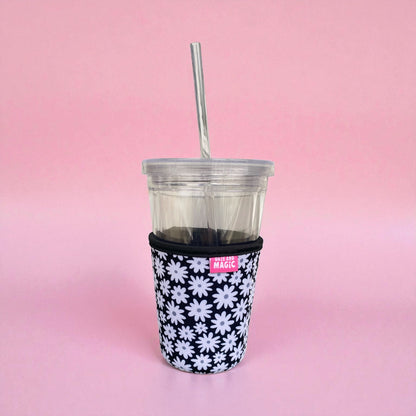 Daisy Daze 16oz neoprene iced coffee sleeve on clear plastic iced coffee cup