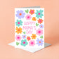 Greeting card with colorful flowers and 'Happy Mama's Day' text on a peach background