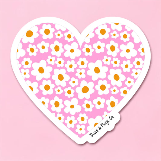 Heart-shaped sticker with floral pattern on a pink background