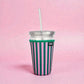 Pink and green striped 24oz neoprene iced coffee sleeve on clear plastic cup
