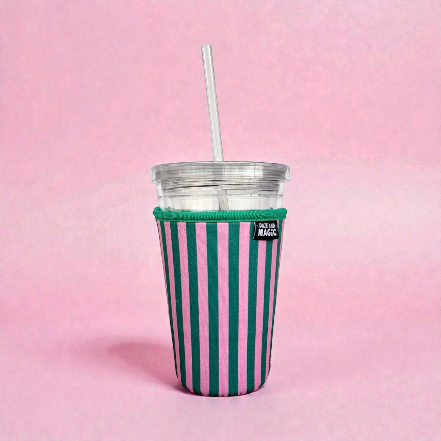 Pink and green striped 24oz neoprene iced coffee sleeve on clear plastic cup