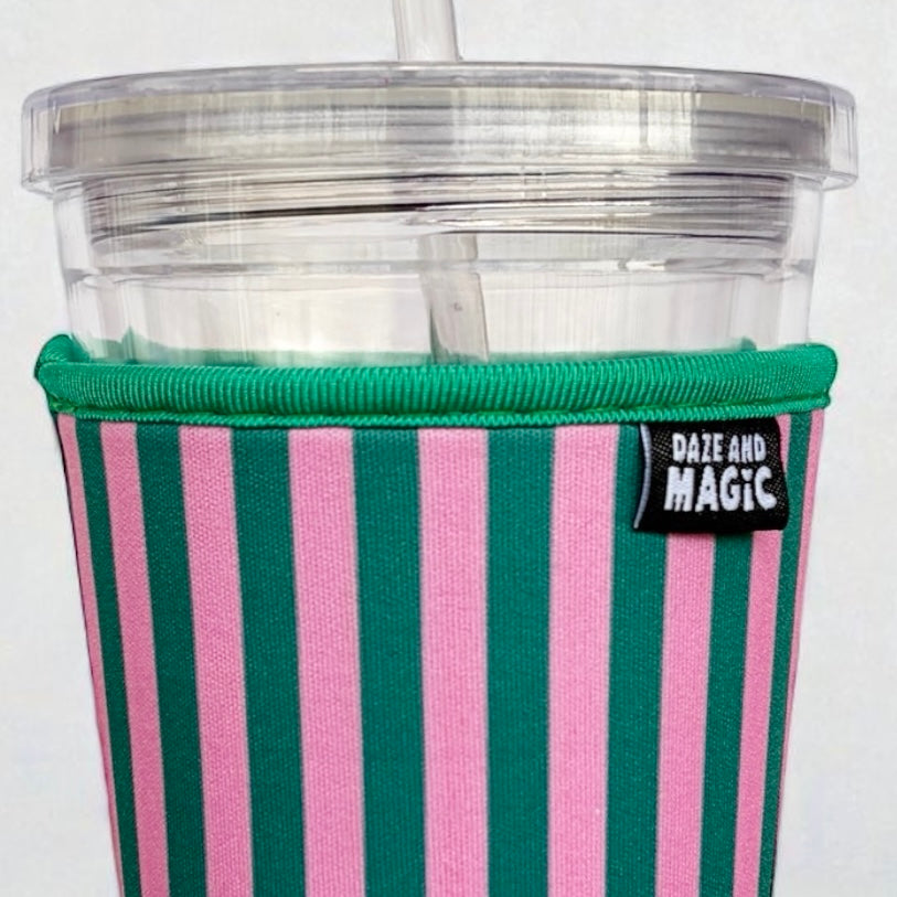 Close-up of neoprene iced coffee sleeve showing pink and green stripes pattern