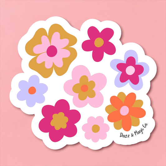 Set of colorful flower-shaped stickers on a pink background